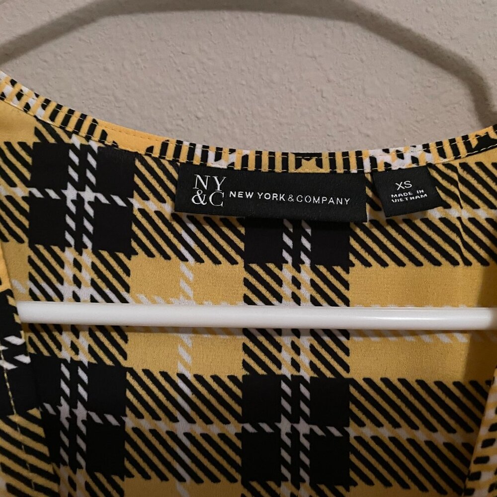 XS New York and Company yellow and black plaid high low puff shoulder top. - Picture 8 of 8